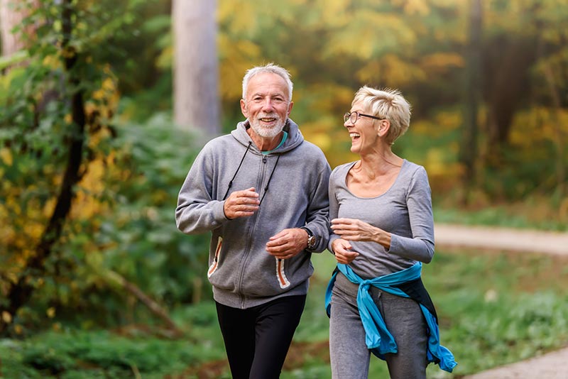 retired couple enjoying a jog new year goals